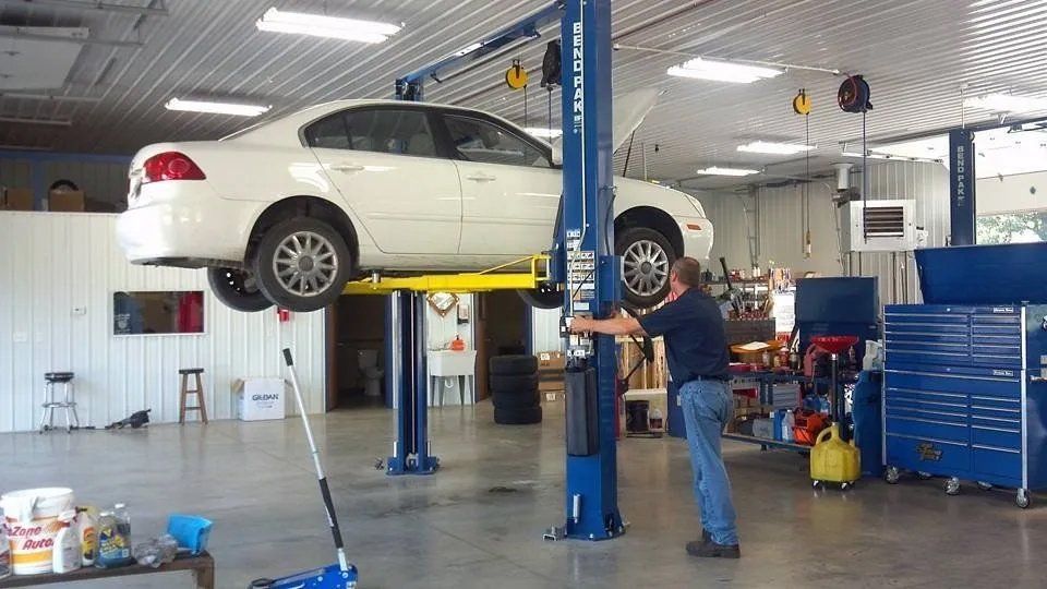 Resident Mechanic Setting Up the Car for Repair