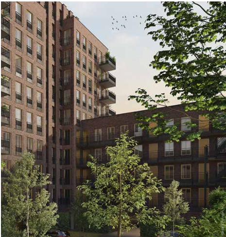 Bakstenen appartementencomplexen omgeven door bomen op een zonnige dag.