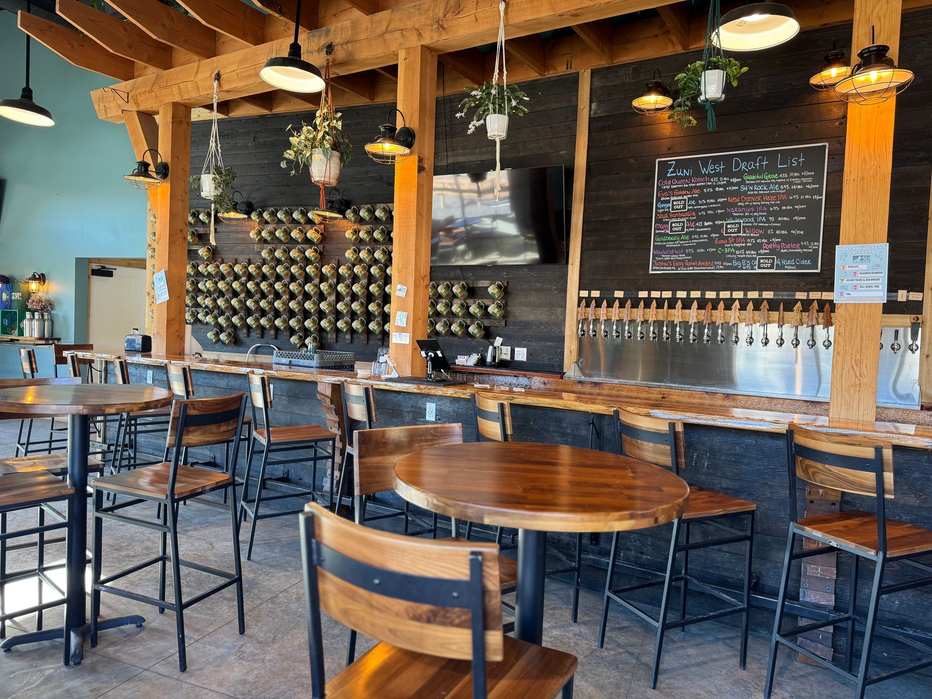 A restaurant with tables and chairs and a bar.