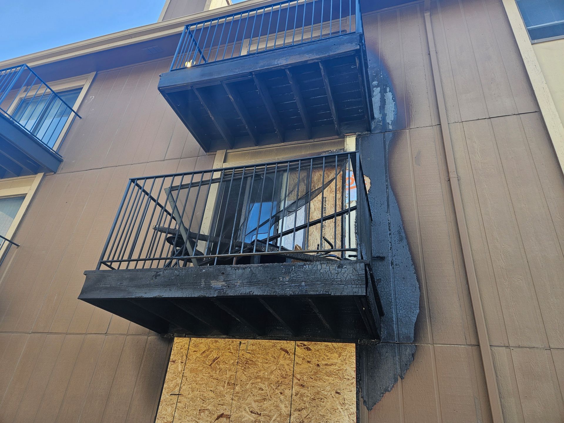 A building with a balcony on the side of it.