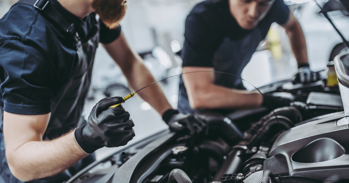 mobile mechanics doing an oil change