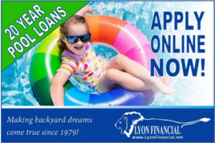 A little girl is floating on an inflatable ring in a pool.