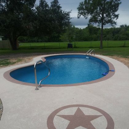 A swimming pool with a star in the middle of it