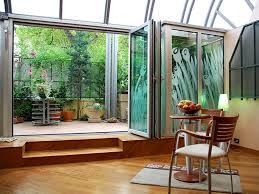 Bright indoor-outdoor living space featuring doors fitted with Replacement Double Glazed Glass for improved insulation.