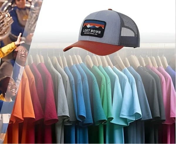 Colorful row of T-shirts on hangers with a gray-and-red baseball cap above them