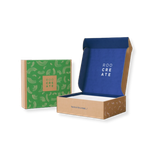 Green patterned box and open blue-and-tan cardboard gift box on a white background