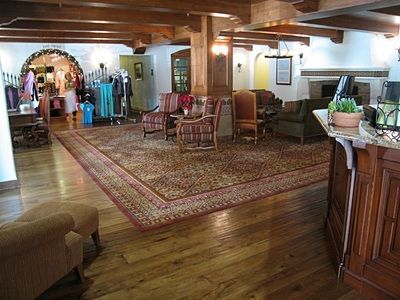 A large room with lots of furniture and a rug