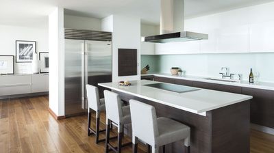 A kitchen with stainless steel appliances and a large island