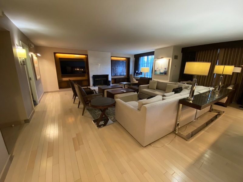 A living room with a lot of furniture and a fireplace