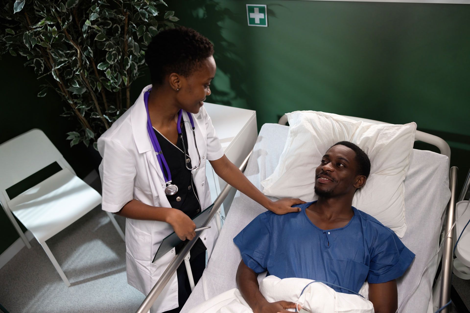 Man having a telehealth appointment with a doctor via laptop.
