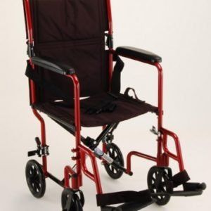 Red folding wheelchair with black seat, armrests, and footrests on a white background