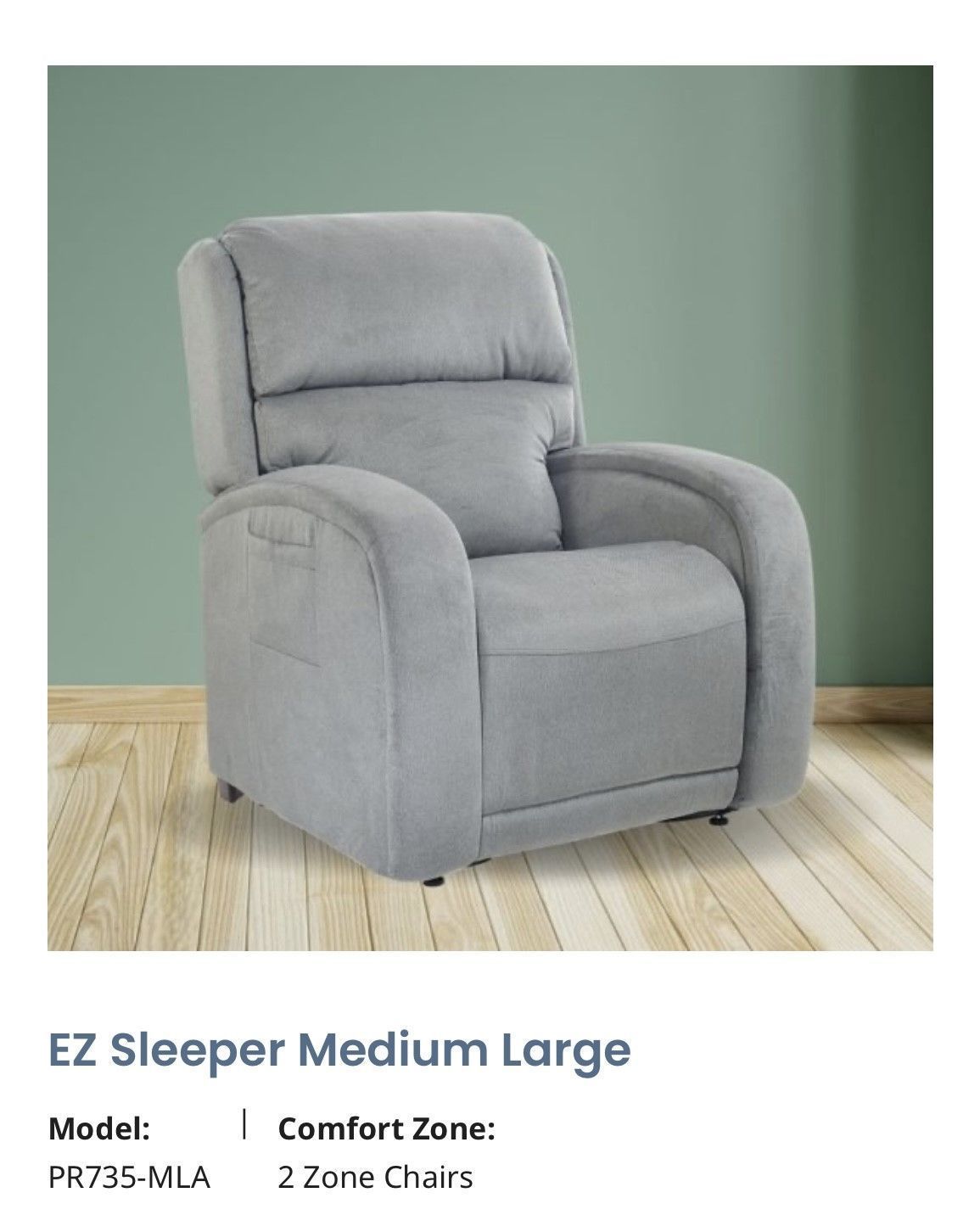 Gray plush recliner chair on a wood floor against a muted green wall, product display.