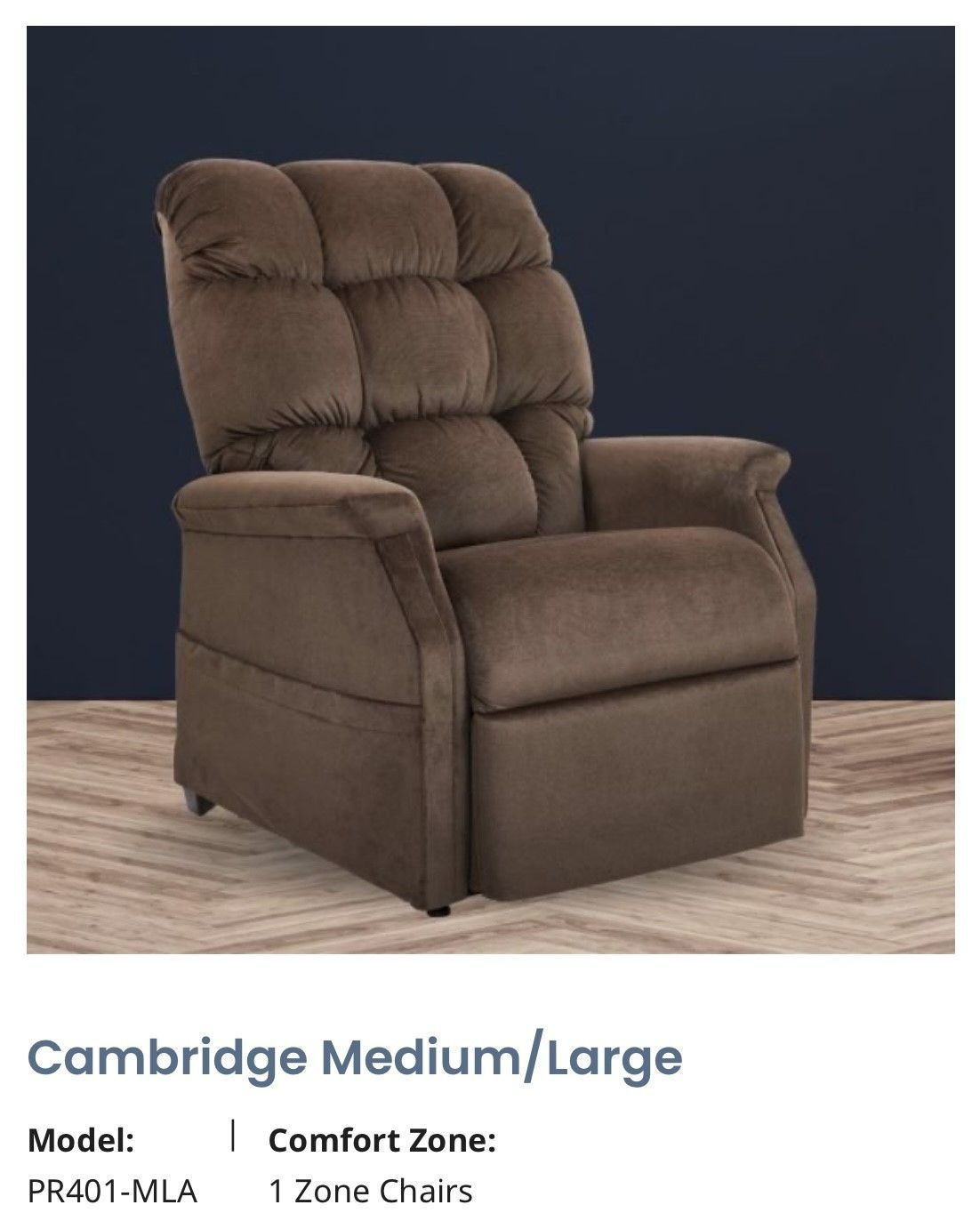 Brown upholstered recliner chair on a wood floor against a dark background.