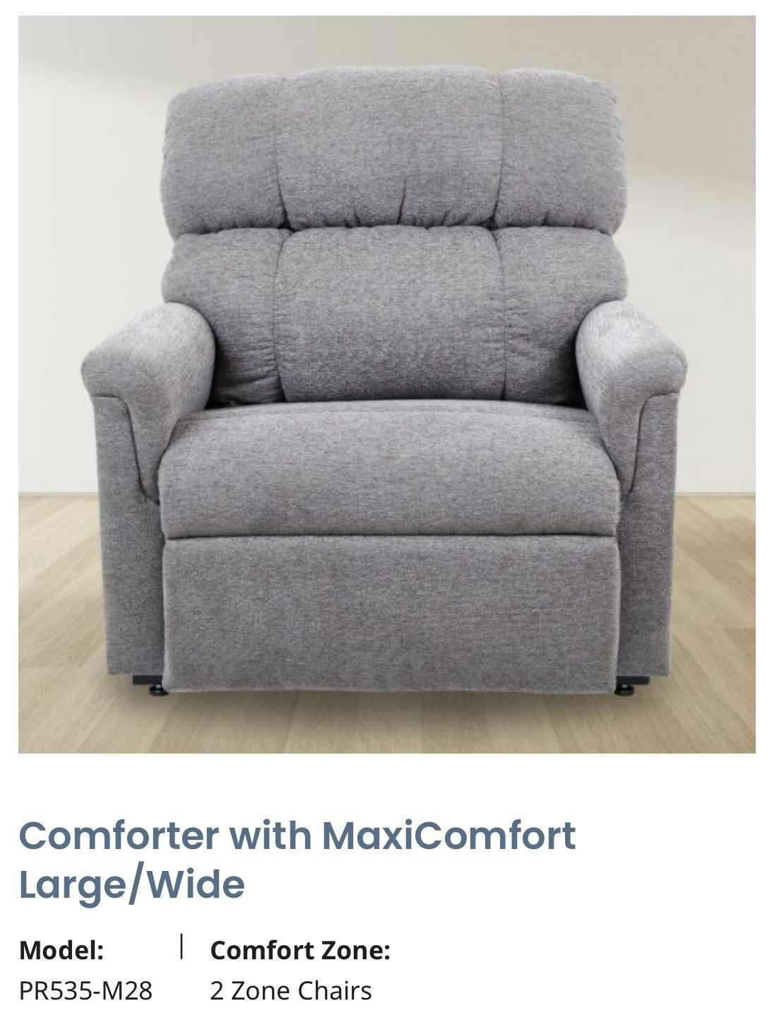 Gray upholstered recliner armchair with headrest and wide seat on a light floor