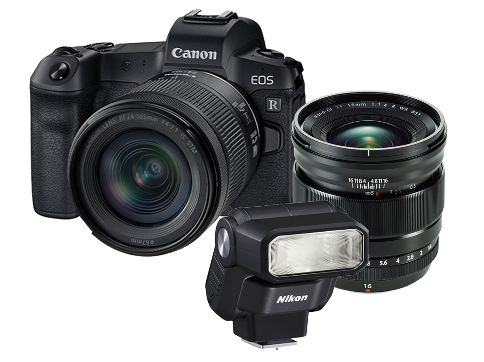 Canon DSLR camera kit with two lenses and an external flash on a white background