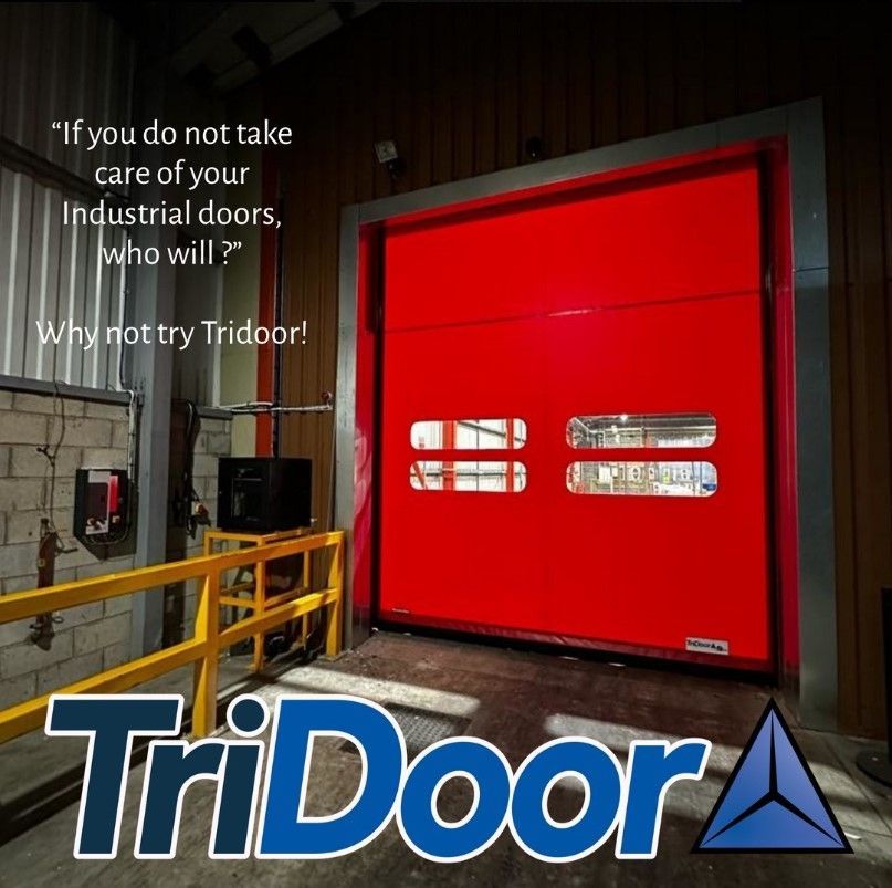 Red industrial door with TriDoor logo and slogan in a warehouse setting