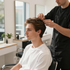 Person getting a haircut in a bright salon