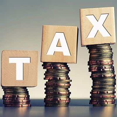 Stacks Of Coins With The Word Tax Written On Them - Individual & Business Taxation & Financial Planning in Mackay