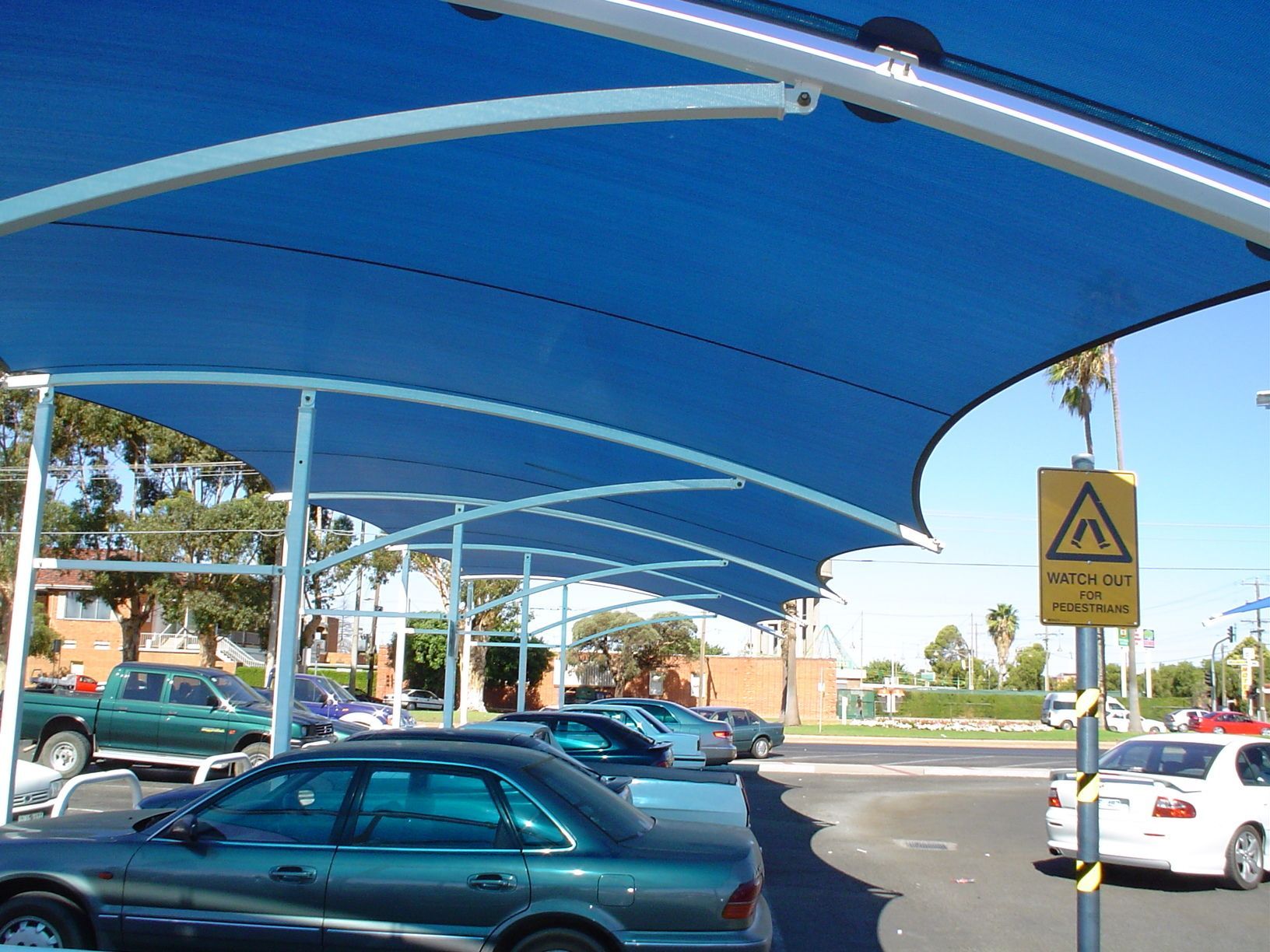 A Blue Fabric Shade Structure Over a Parking Lot — The Gazebo and Shade Centre in Jindera, NSW