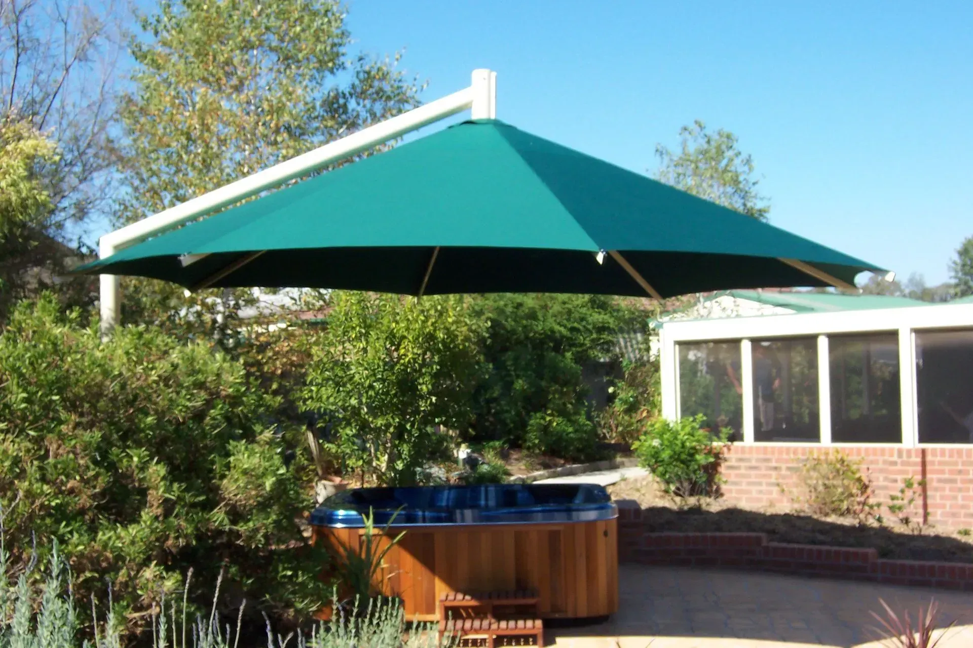 Green Umbrella Shades a Hot Tub — The Gazebo and Shade Centre in Jindera, NSW