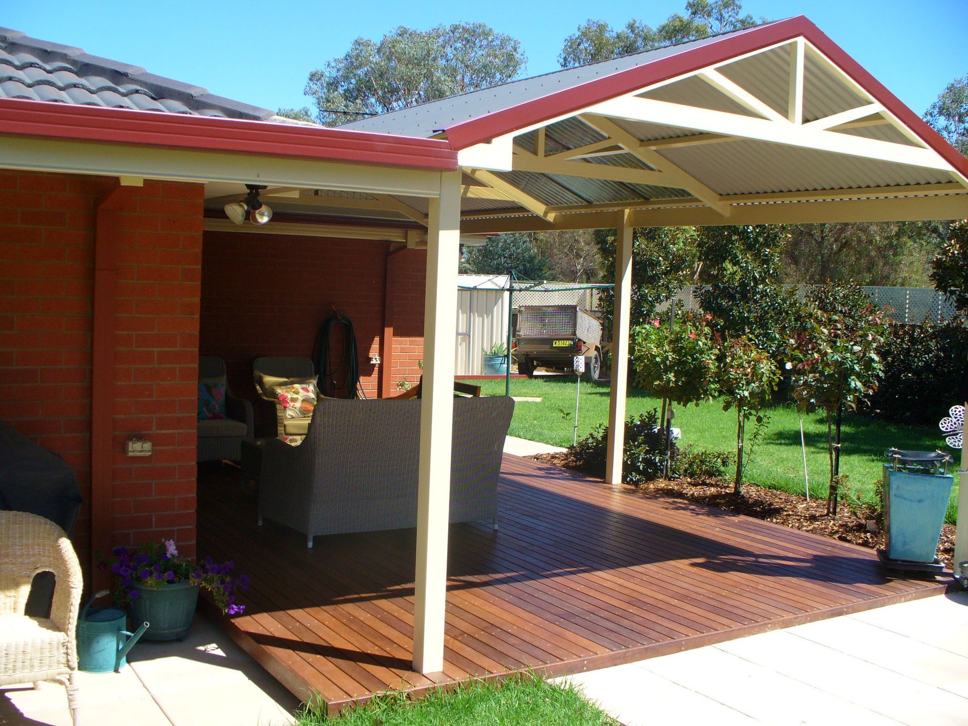 A Shaded Wooden Deck Attached to a Brick Home — The Gazebo and Shade Centre in Jindera, NSW