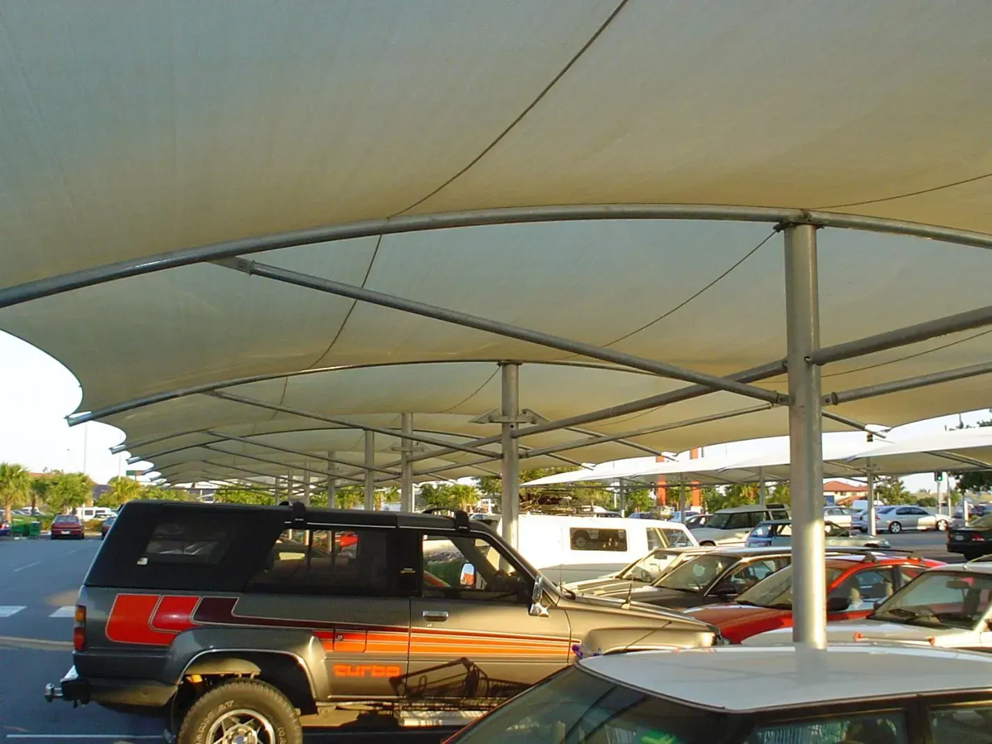 Car Park With Fabric Shade Covers, Cars Parked Beneath — The Gazebo and Shade Centre in Jindera, NSW