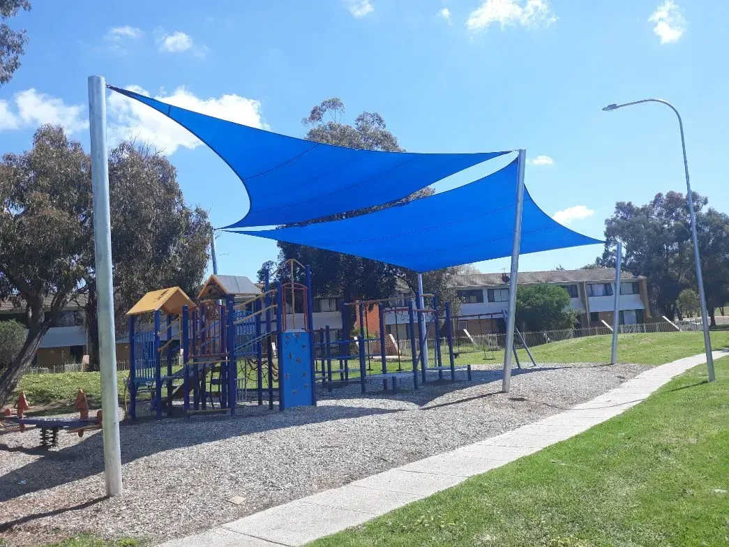 Playground Shaded by Two Blue Sails — The Gazebo and Shade Centre in Jindera, NSW