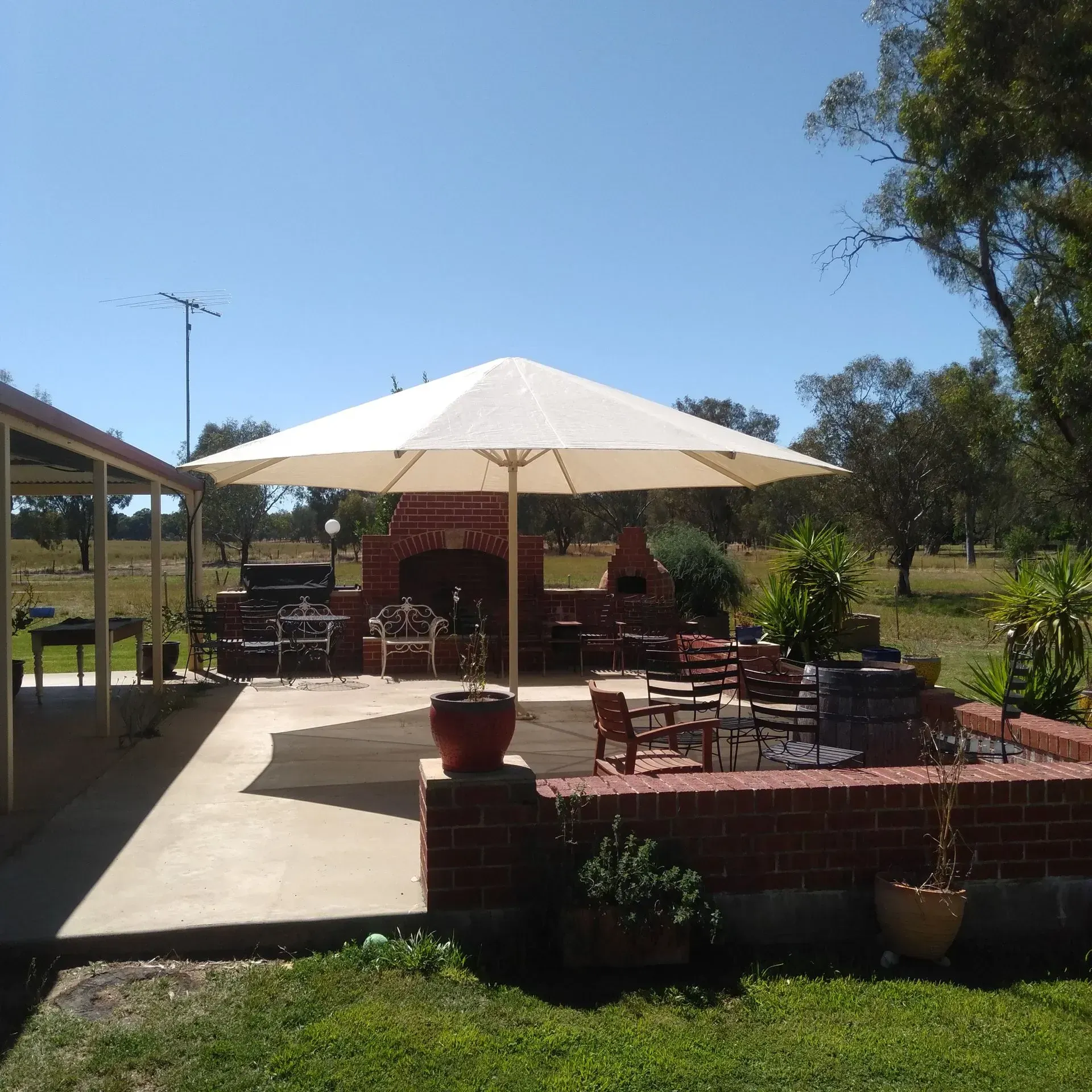 Outdoor Patio With Brick Features, Umbrella — The Gazebo and Shade Centre in Jindera, NSW