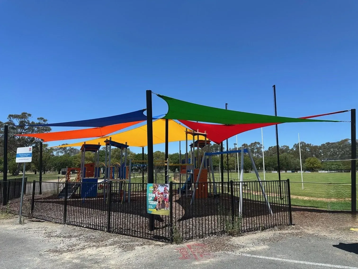 Playground With Colourful Shade Sails, Black Fence — The Gazebo and Shade Centre in Jindera, NSW