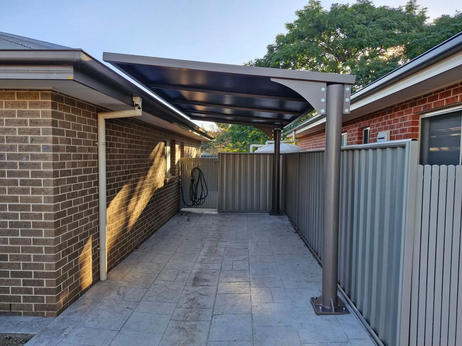 Carport With Dark Roof — The Gazebo and Shade Centre in Jindera, NSW