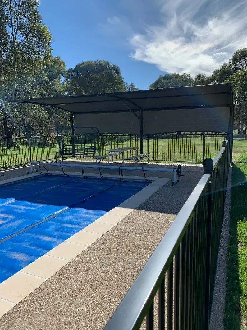 Swimming Pool Covered by a Shade Structure — The Gazebo and Shade Centre in Jindera, NSW