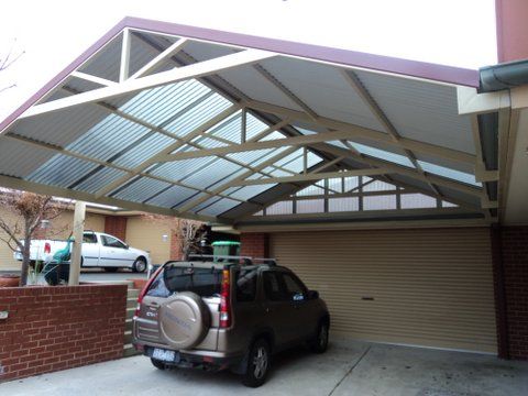 A Beige SUV is Parked Under a Gabled Carport — The Gazebo and Shade Centre in Jindera, NSW