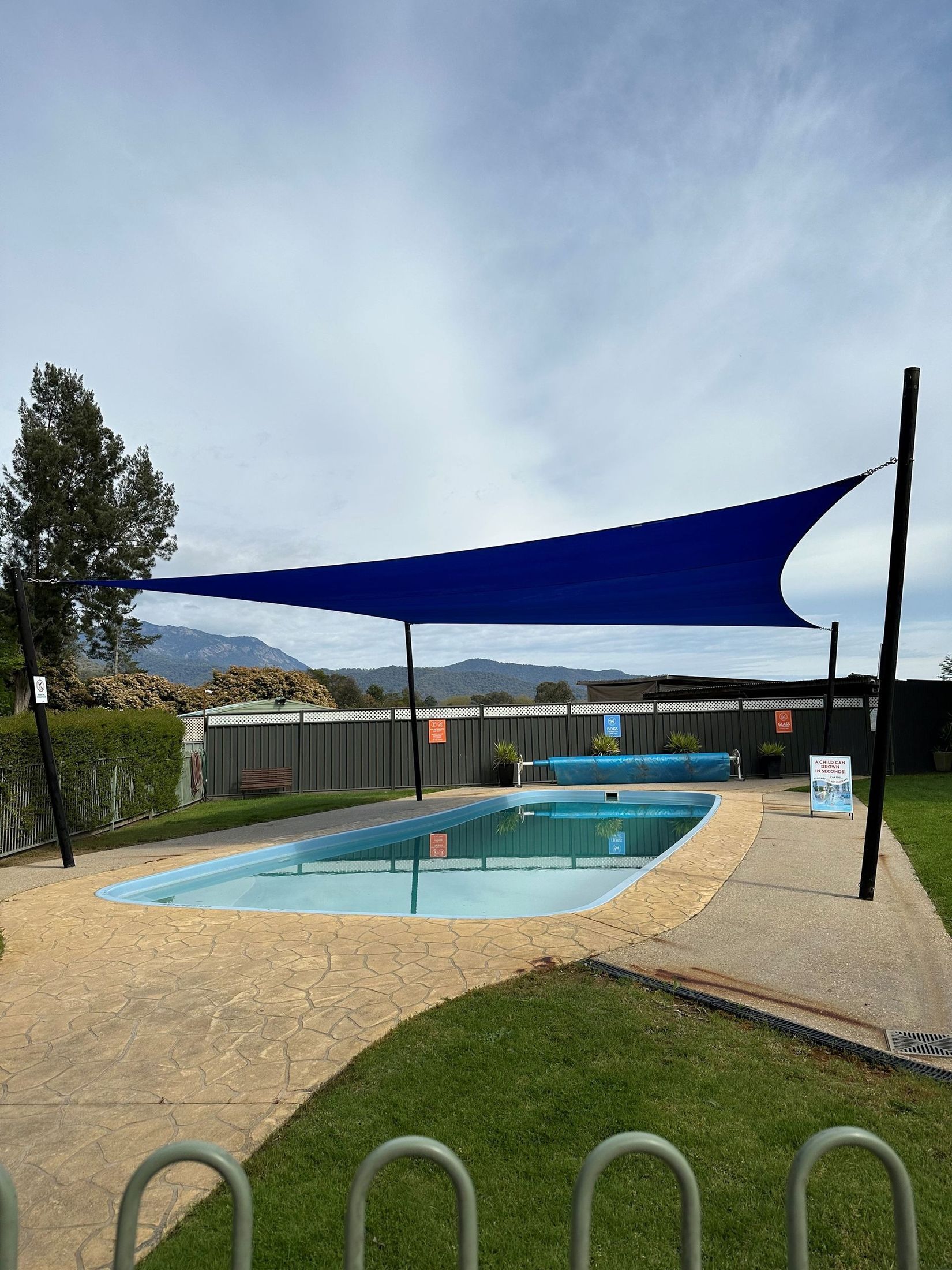 Blue Shade Sail Over a Rectangular Swimming Pool — The Gazebo and Shade Centre in Jindera, NSW
