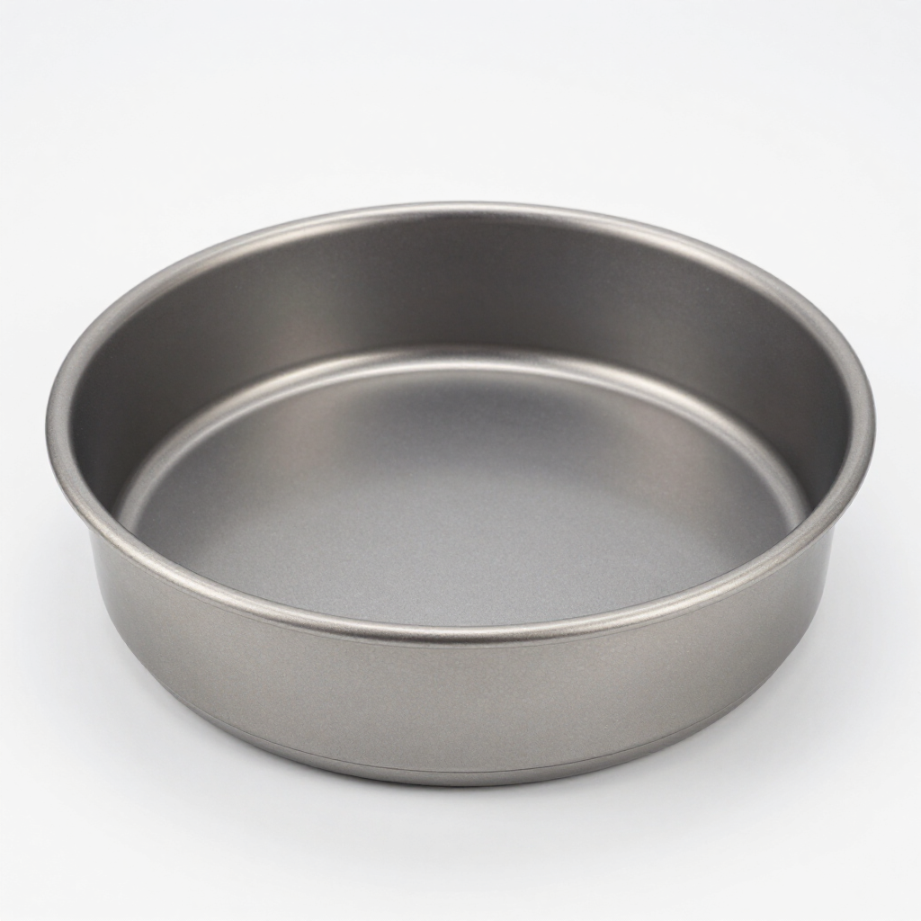Empty round gray metal baking pan on a white background