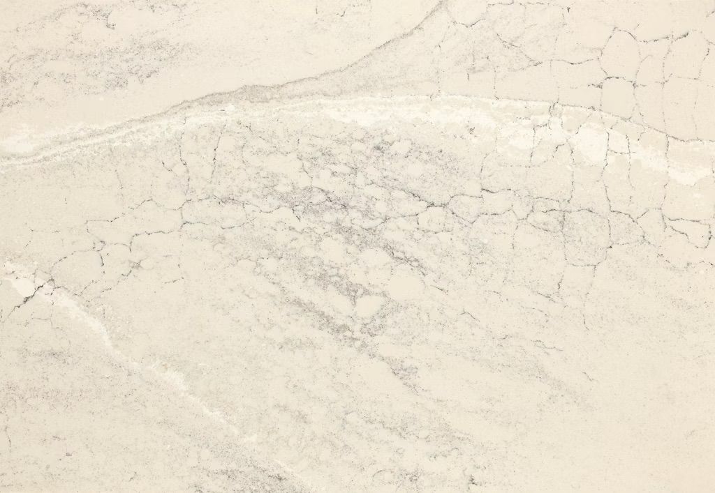 Textured beige wall with gray markings and fine cracks.