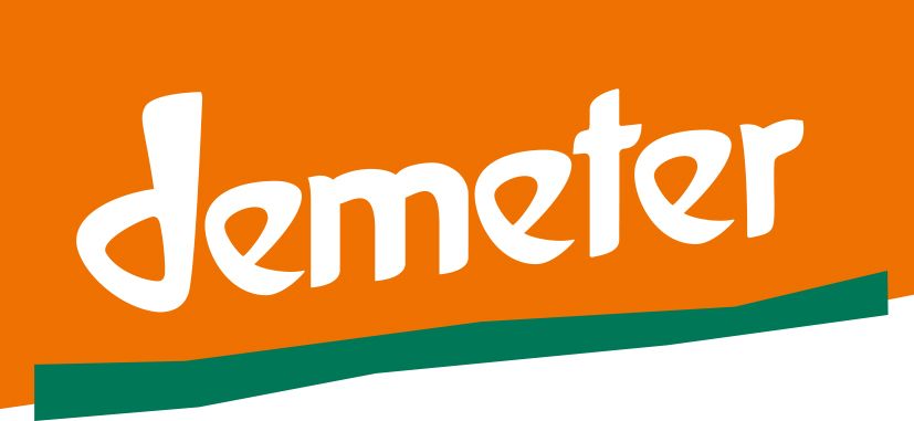 Demeter logo in white on an orange background with a green underline