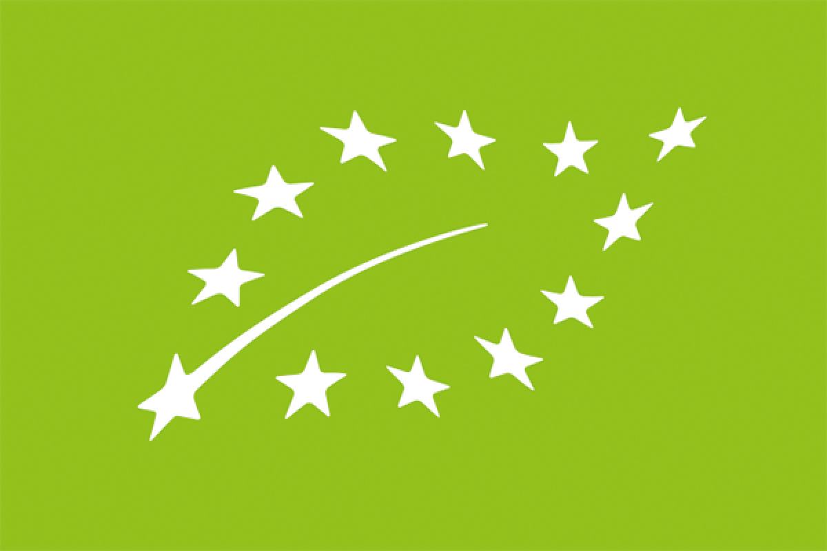 White EU organic leaf logo on a bright green background