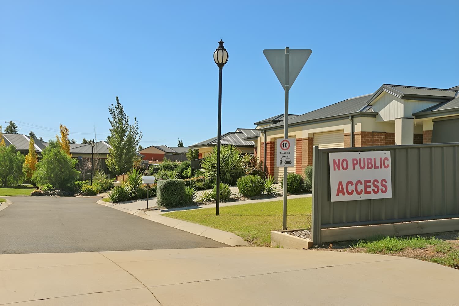 View of a street with a no public access sign on the fence — North Coast Conveyancing In Port Macquarie, NSW