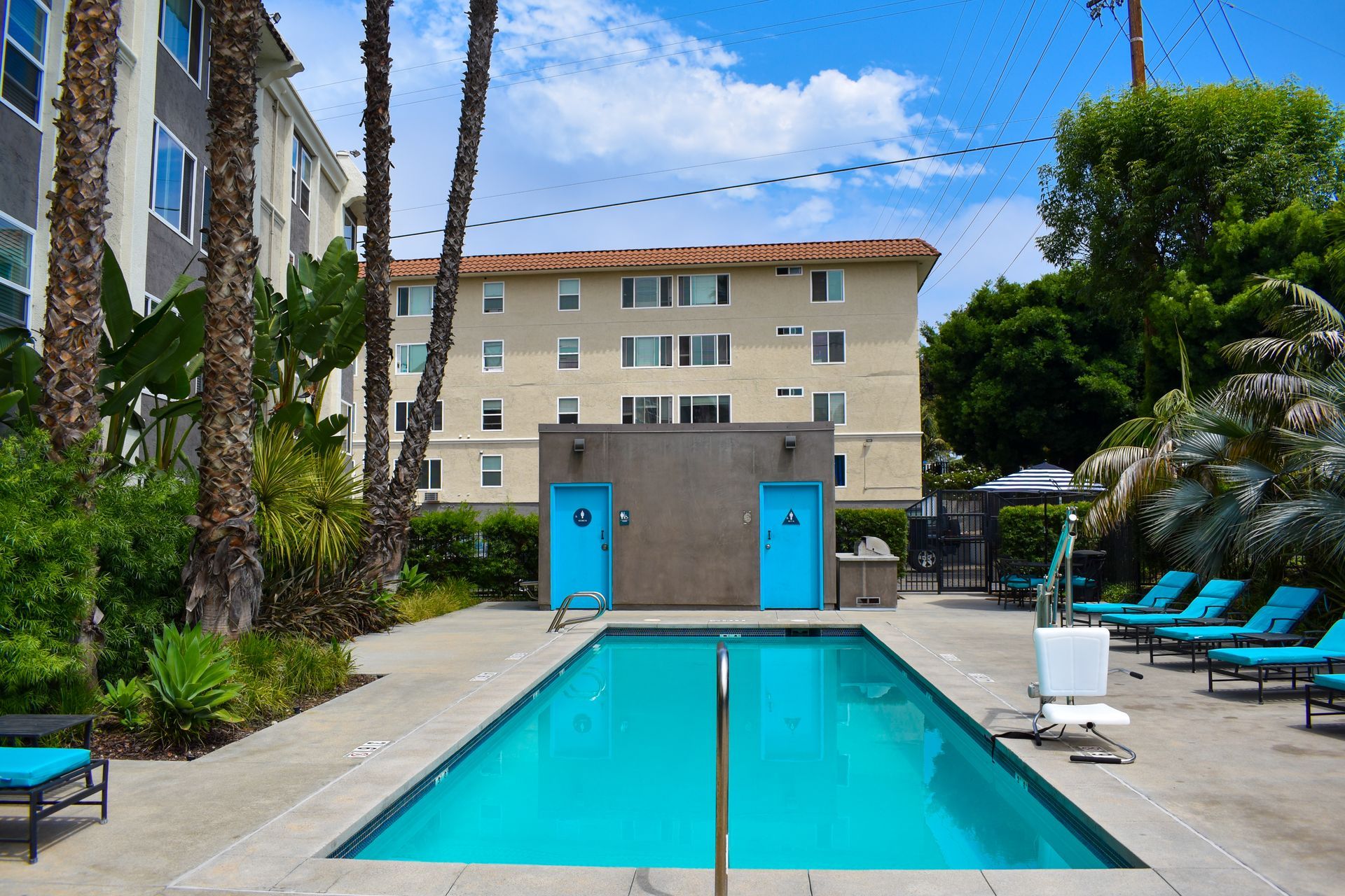 a large swimming pool with a building in the background