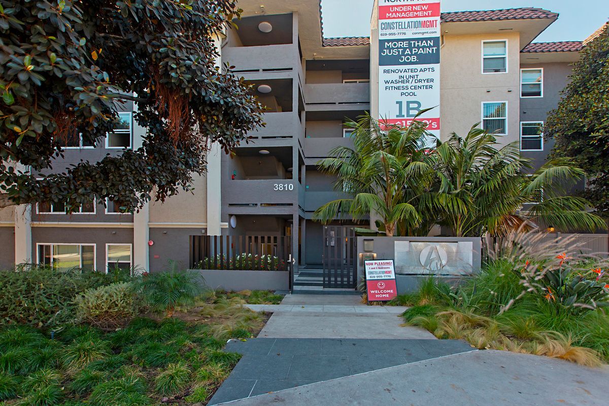 a large apartment building with a sign that says 18 on it