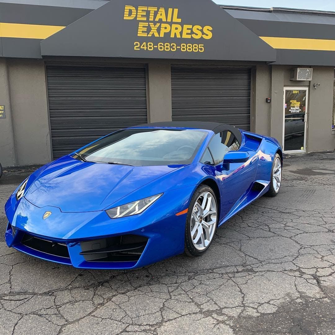 Blue sports car parked outside Detail Express auto shop