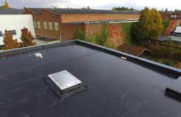 There is a skylight on the roof of a building.
