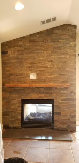 There is a fireplace in the middle of the room.