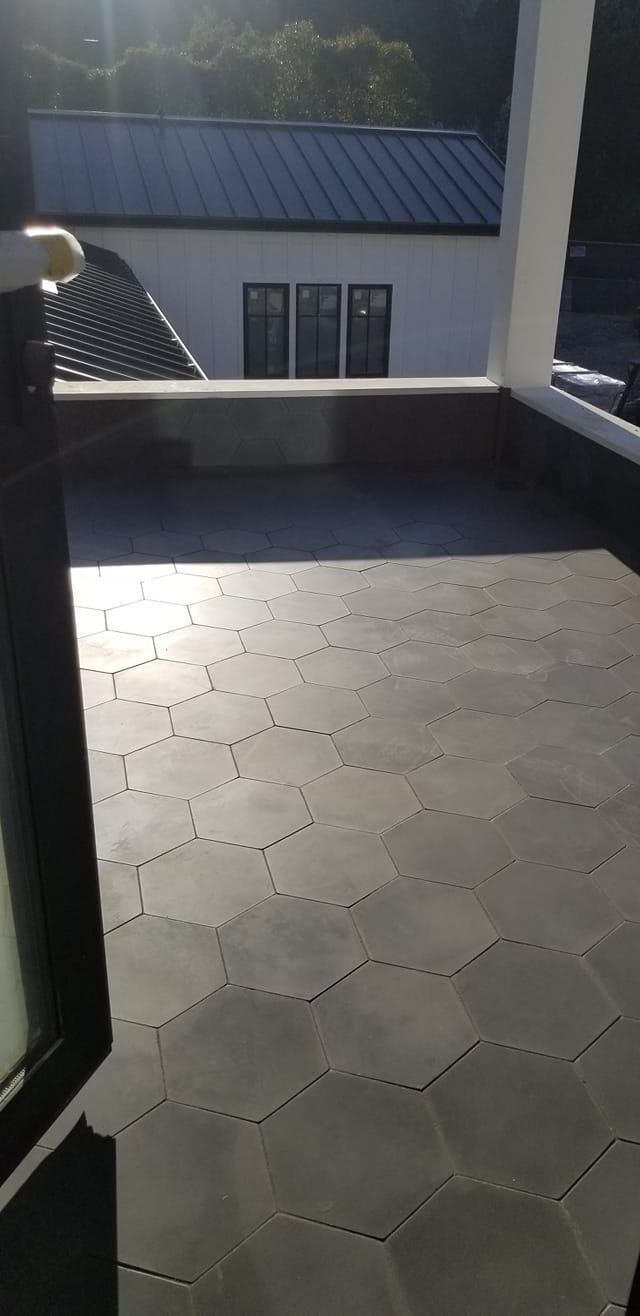 A patio made of hexagon tiles in the sun.