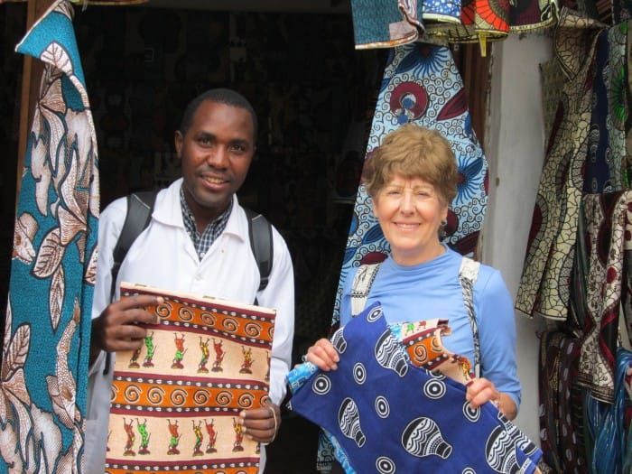 Nettie Graulich and Ayami displaying handmade sewing projects at the MCV Sewing Project in Malawi