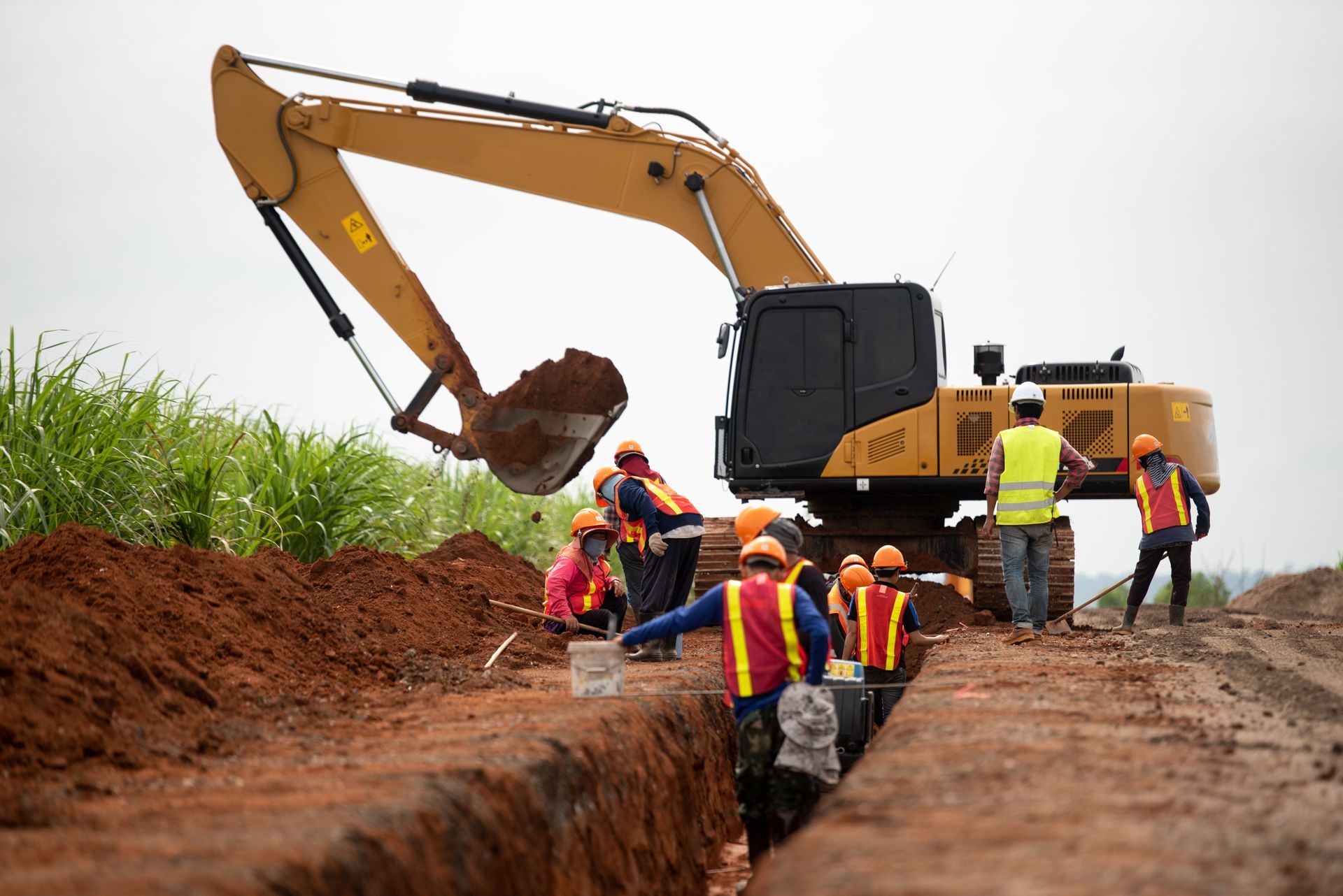 Group of worker and construction engineer wear safety uniform excavation water drainage at construction site
