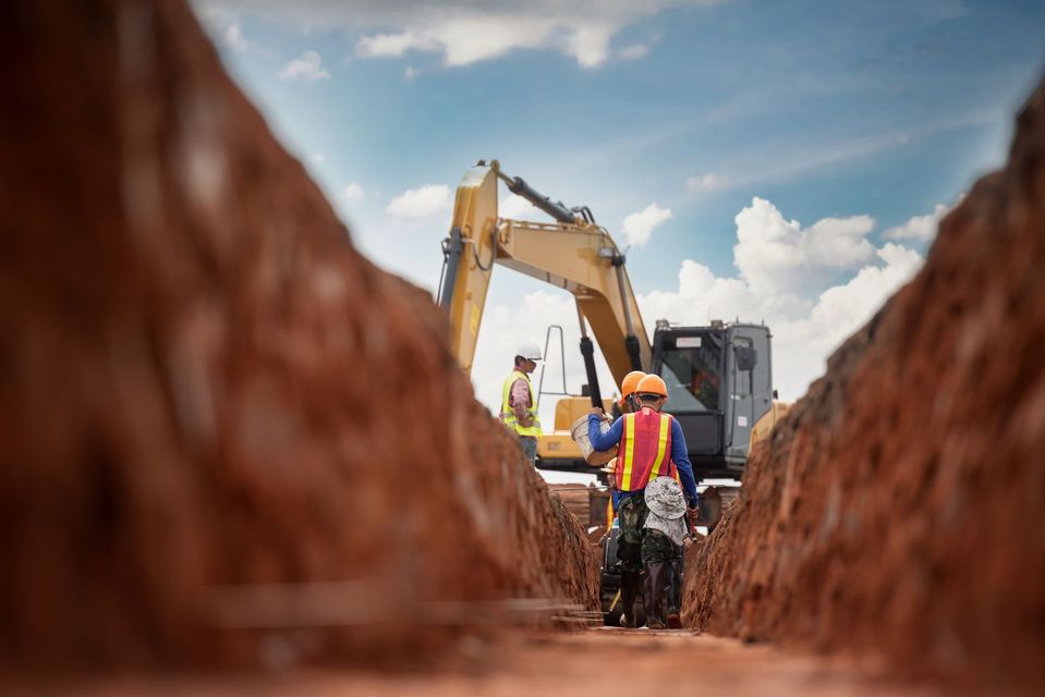 Group of worker and construction engineer wear safety uniform excavation water drainage at construction site