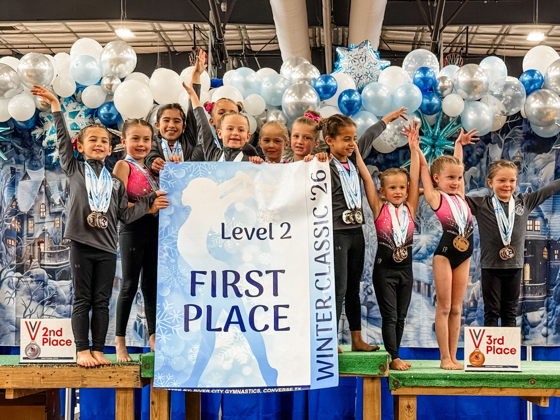 Level 2 gymnastics team holding 