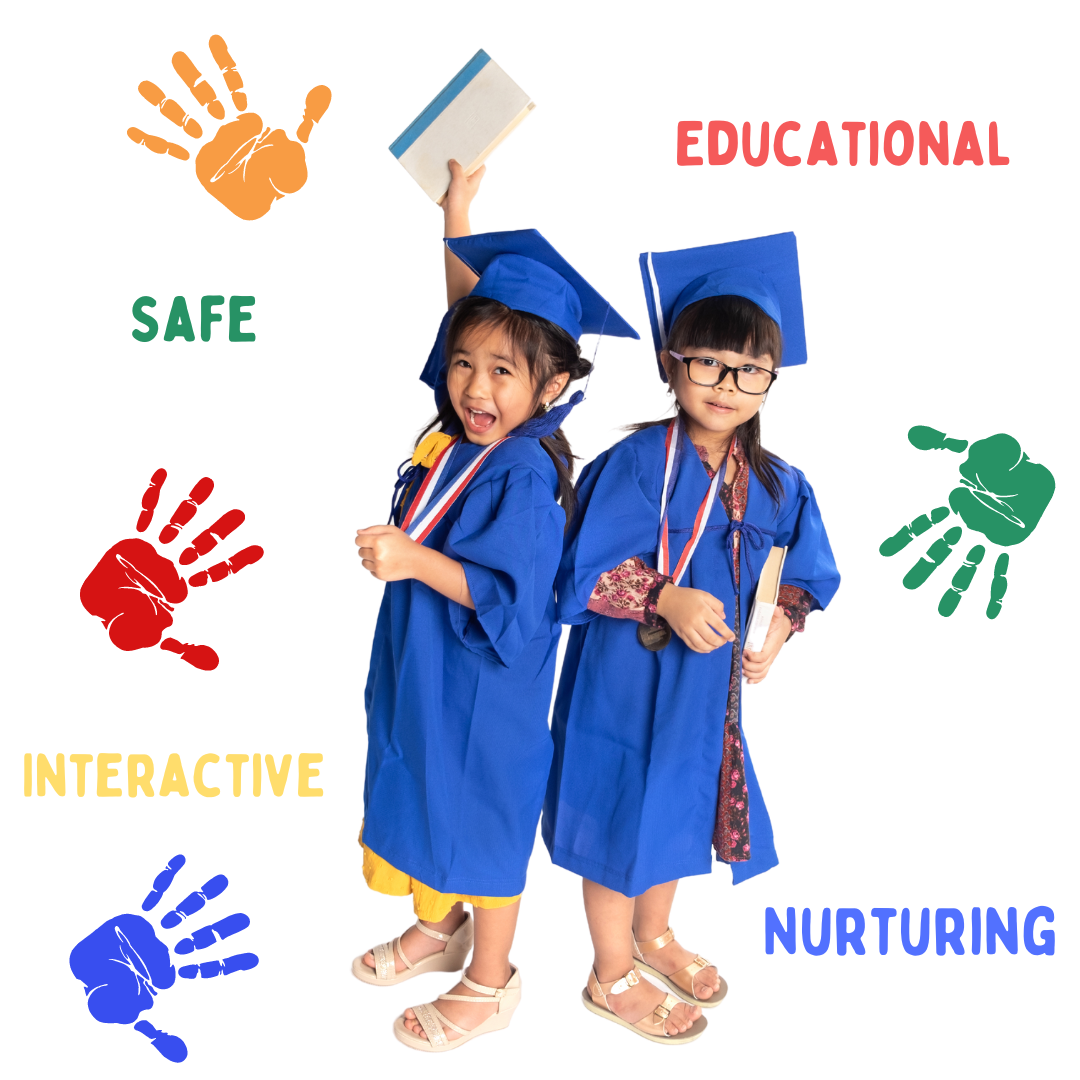 Two little girls in graduation gowns are standing next to each other