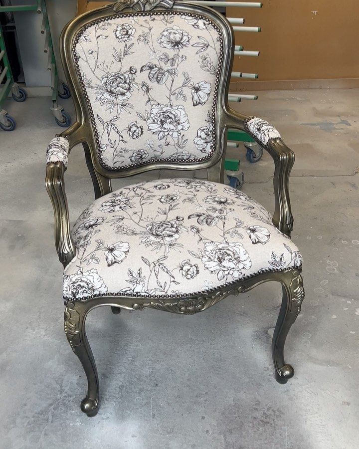 a chair with a floral pattern on the seat and back